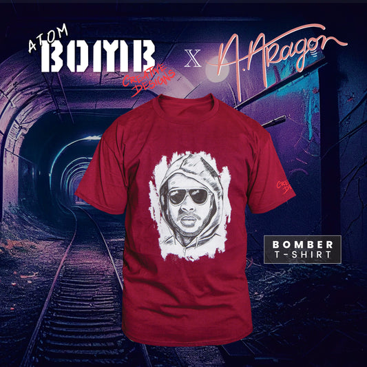 the Bomber men's short-sleeve t-shirt by Atom Bomb delivers the cut and quality you look for in a classic crewneck tee. Details like a lay-flat collar and shoulder-to-shoulder taping are standard in a men's t-shirt designed to last. Printed across the front is a menacing illustration of rapper Atom Bomb drawn by Phoenix illustrator Angelina Aragon and inspired by the police sketch of Unibomber Ted Kaczynski.